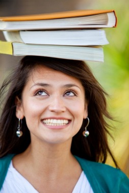 student balancing books